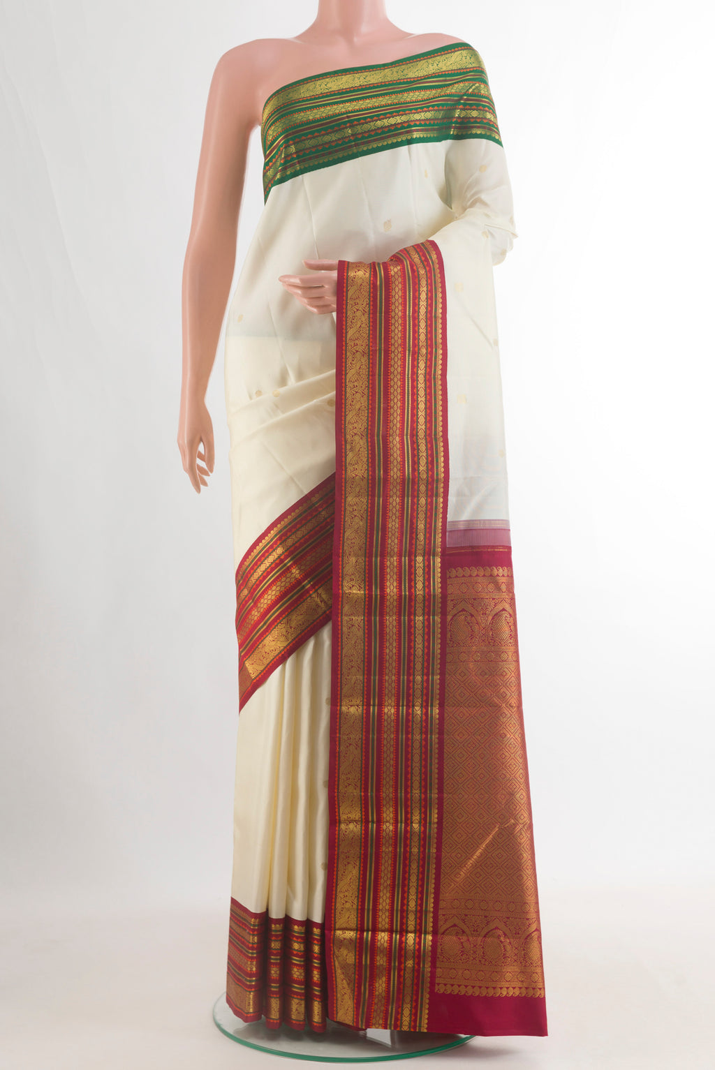 Pure Silk Off White Kanjivaram Saree with Zari Butta on the body and Ganga Jamuna Border.  displayed on a mannequin