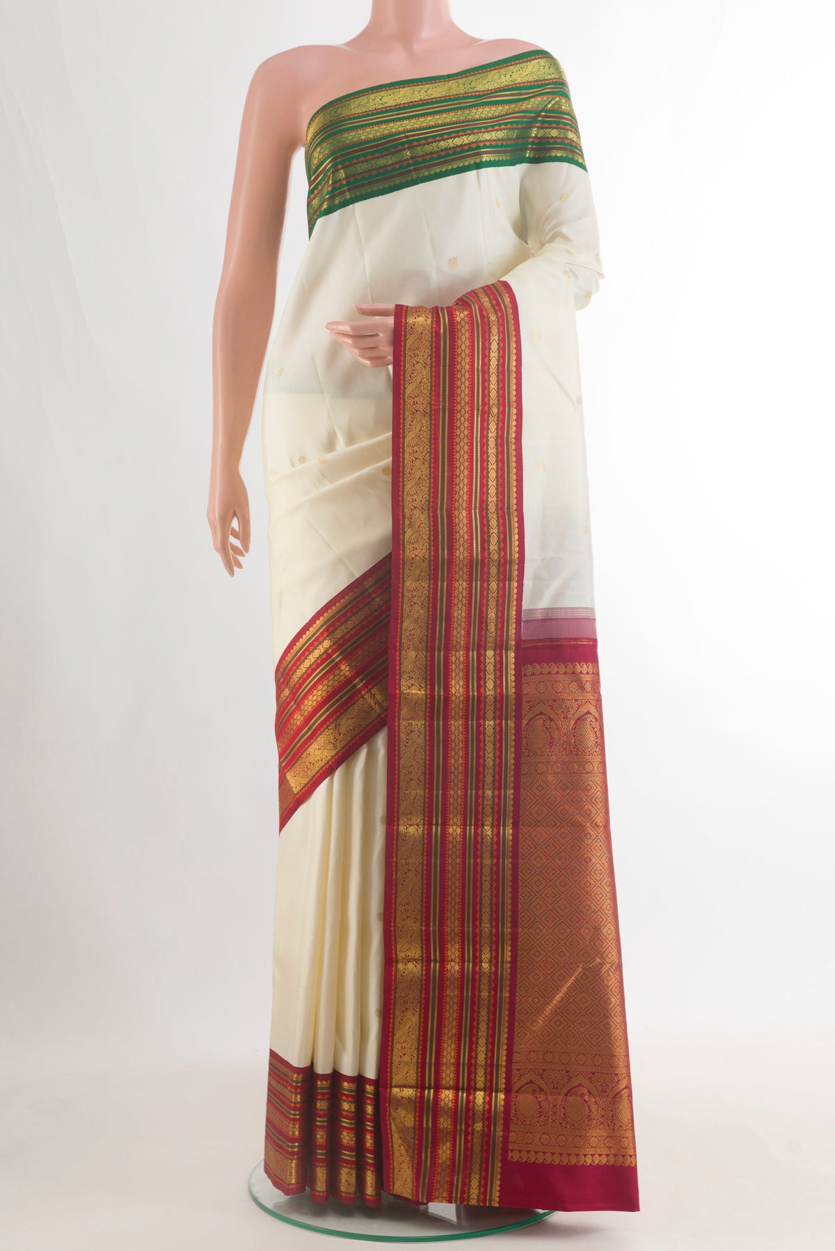 Pure Silk Off White Kanjivaram Saree with Zari Butta on the body and Ganga Jamuna Border.  displayed on a mannequin