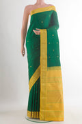 Pure Silk Green Kanjivaram Saree with Zari Butta on the body and Zari Border.  displayed on a mannequin