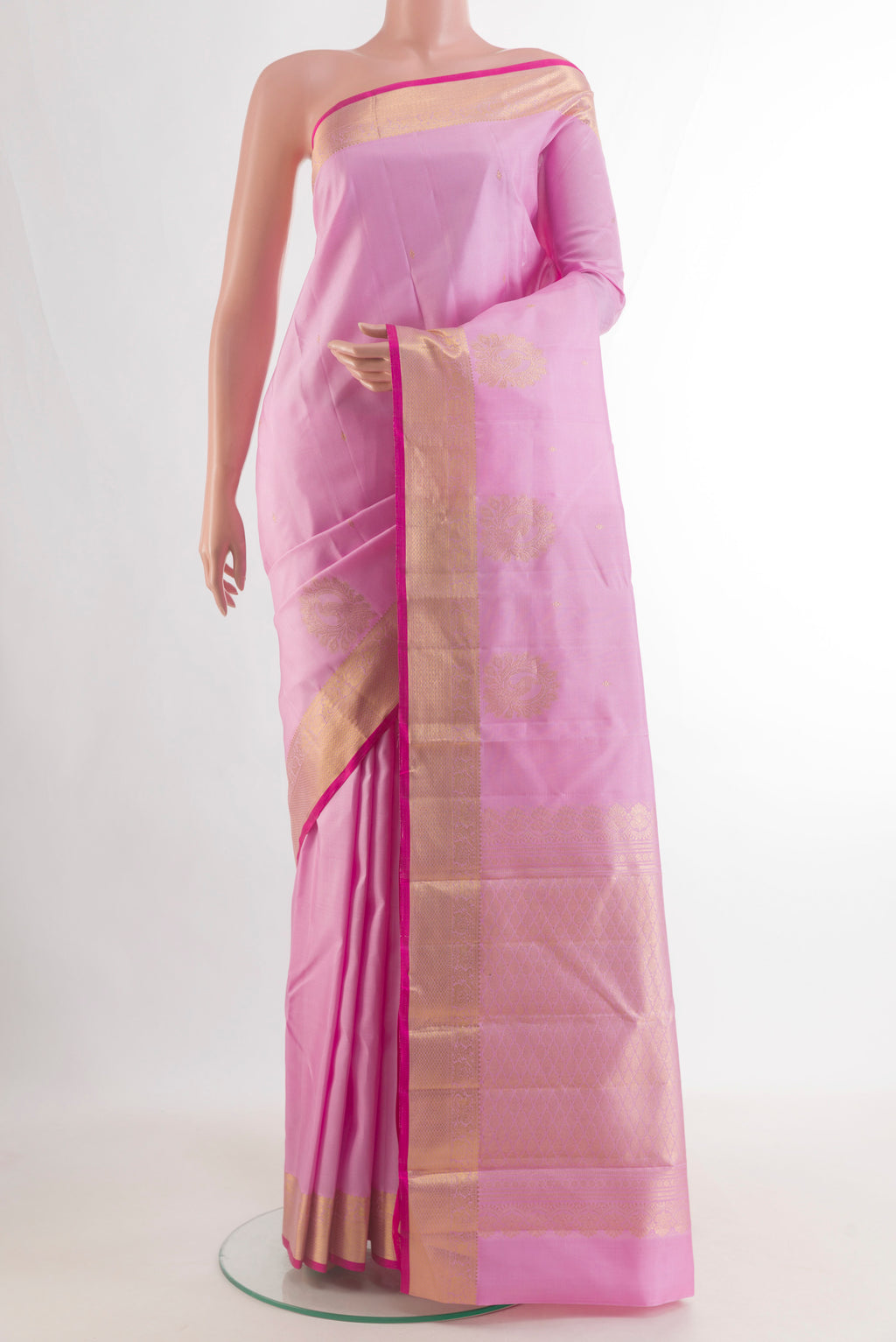 Pure Silk Pink Kanjivaram Saree with Zari Butta on the body and Zari Border.  displayed on a mannequin
