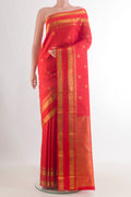 Pure Silk Red Kanchipuram Saree with Zari Butta on the body and Zari Border.  displayed on a mannequin