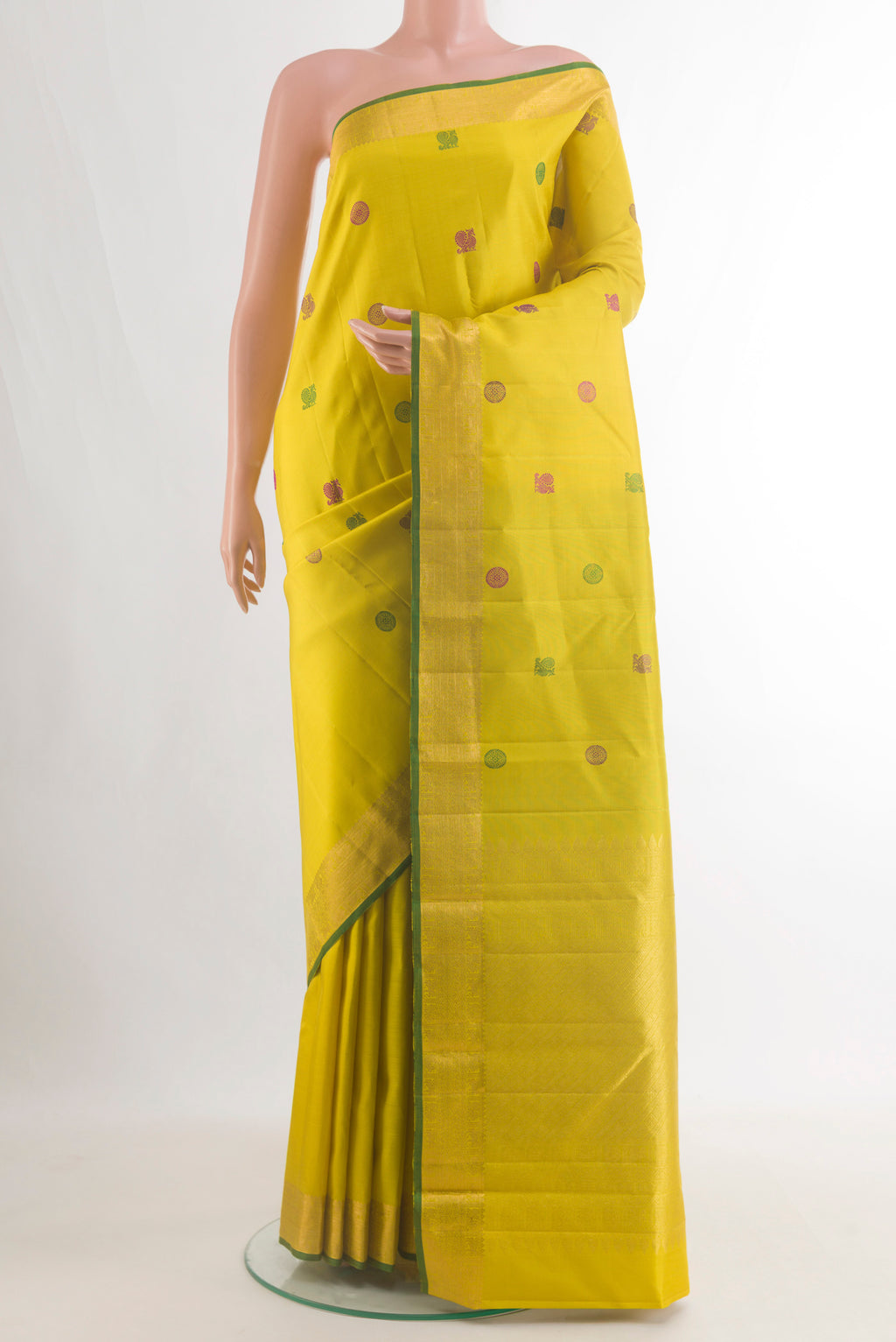 Pure Silk Yellow Kanchipuram Saree with Thread Butta on the body and Zari Border.  displayed on a mannequin