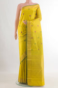 Pure Silk Yellow Kanchipuram Saree with Thread Butta on the body and Zari Border.  displayed on a mannequin