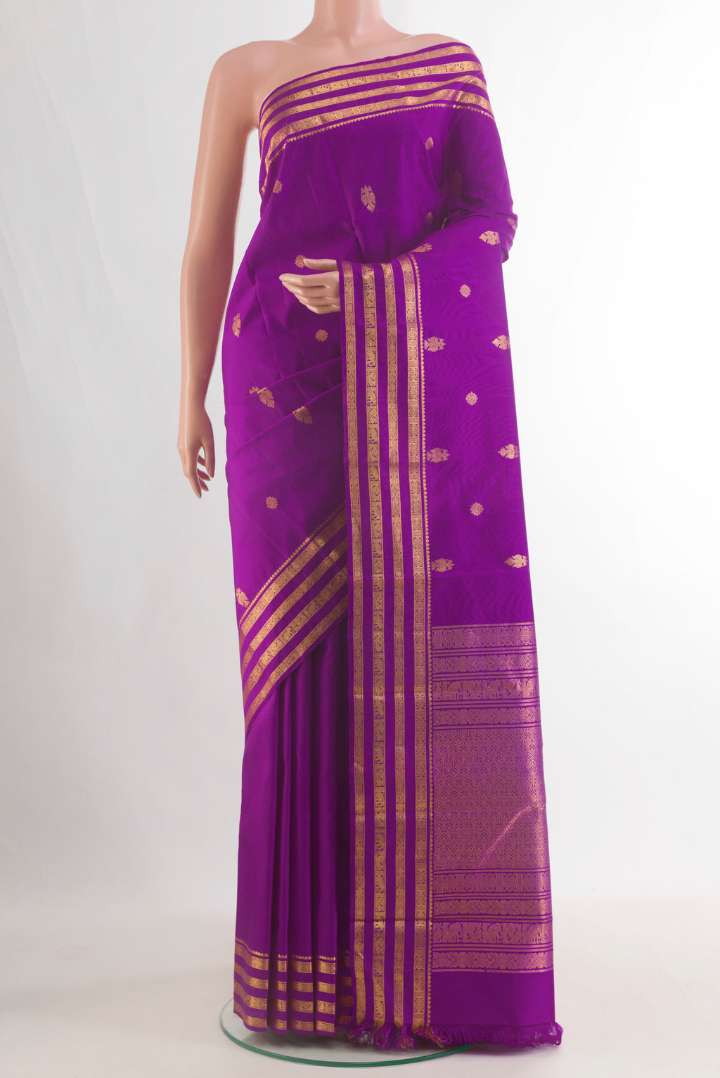 Pure Silk Purple Kanchipuram Saree with Zari Butta on the body and Zari Border.  displayed on a mannequin