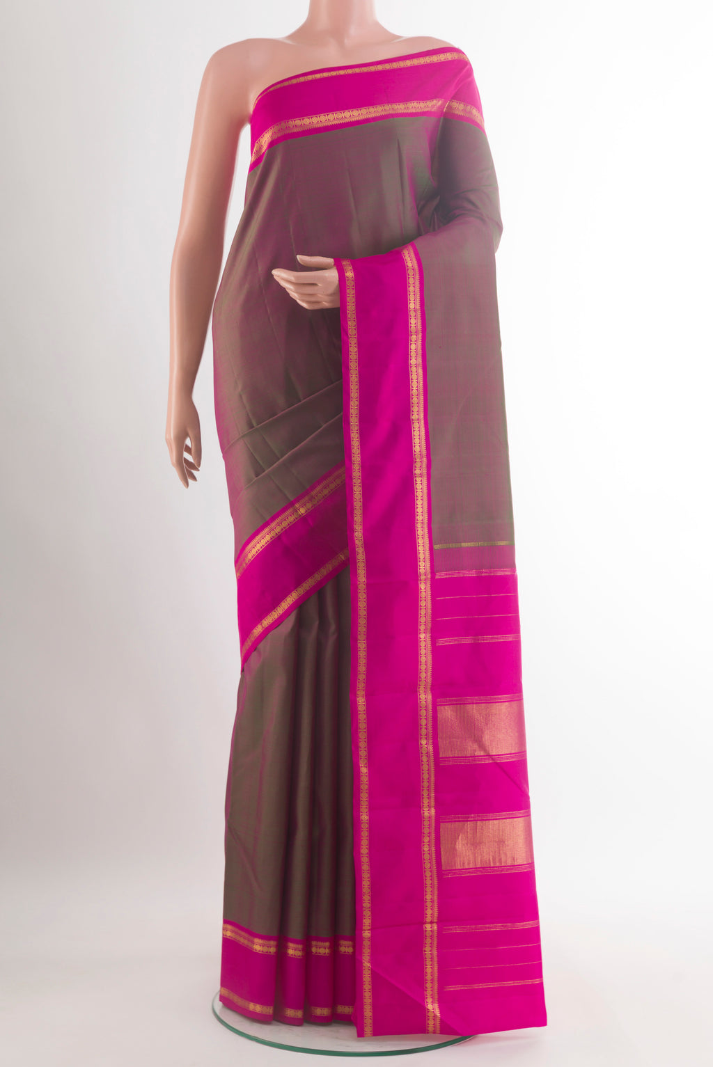 Pure Silk Green with Pink Color Kanchipuram Saree with Plain Body and Plain Border.  displayed on a mannequin