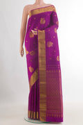 Pure Silk Magenta Kanjivaram Saree with Zari Butta on the body and Zari Border.  displayed on a mannequin