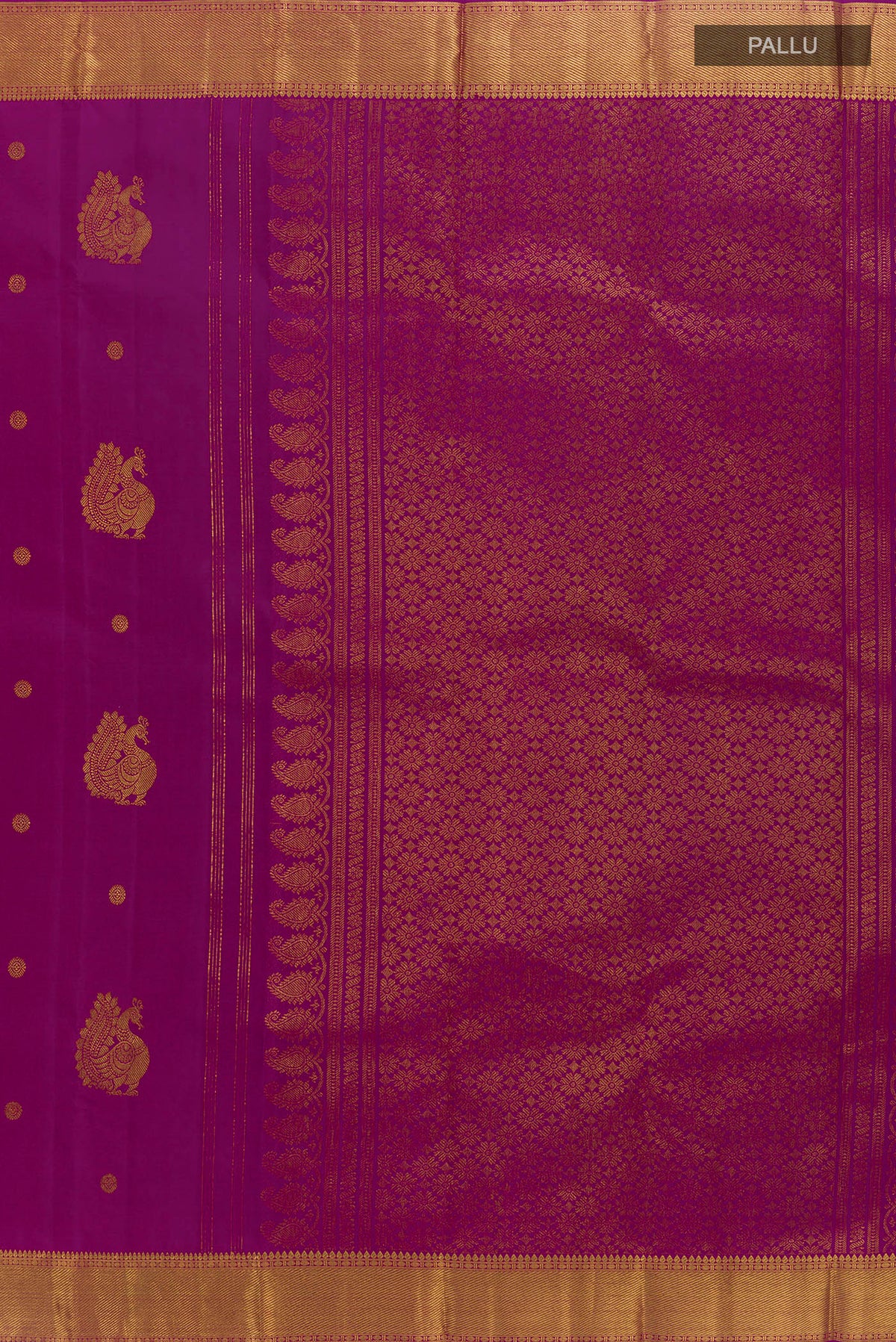 Close up image of the pallu of Pure Silk Magenta Kanjivaram Saree with Zari Butta on the body and Zari Border. 