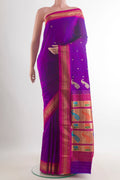 Pure Silk Purple Paithani Saree with Zari Butta on the body and Zari Border.  displayed on a mannequin