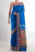 Pure Silk Royal Blue Paithani Saree with Zari Butta on the body and Zari Border.  displayed on a mannequin