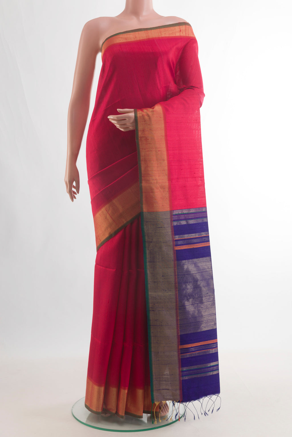 Pure Silk Red Raw Saree with Plain Body and Zari Border.  displayed on a mannequin