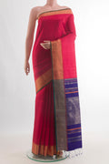 Pure Silk Red Raw Saree with Plain Body and Zari Border.  displayed on a mannequin