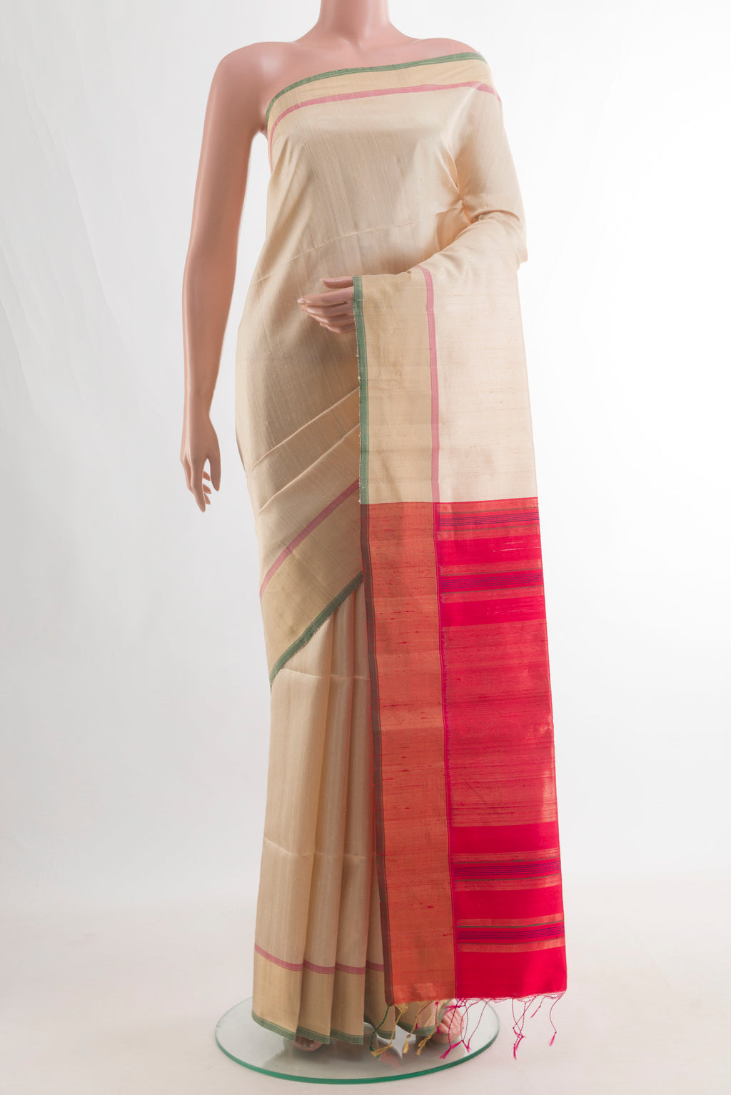 Pure Silk Cream Raw Saree with Plain Body and Zari Border.  displayed on a mannequin
