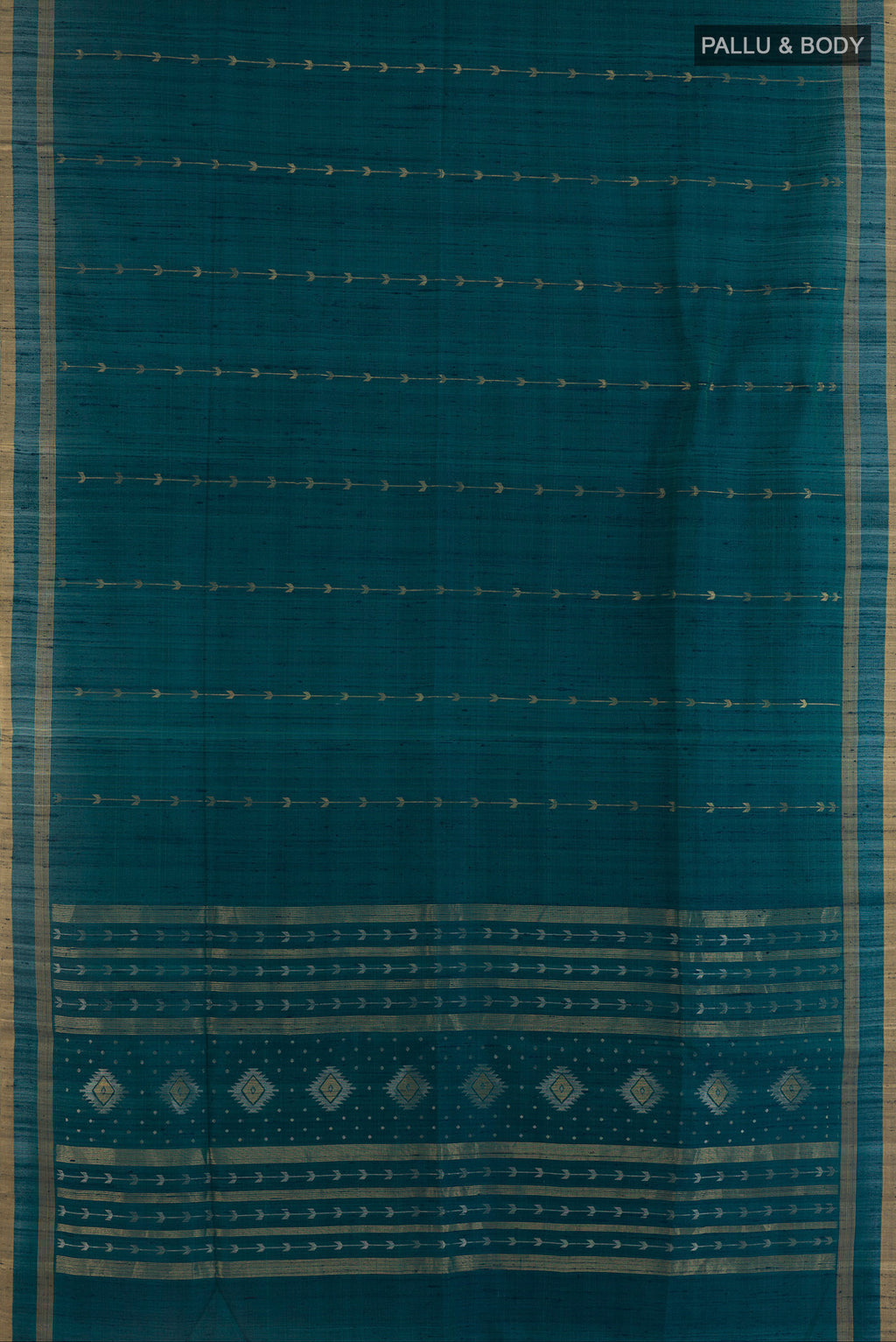 Flat view of Pure Silk Teal Raw Saree with Zari Butta on the body and Zari Border. 