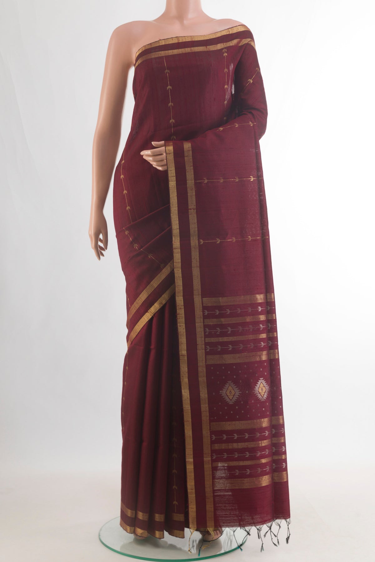 Pure Silk Brown Raw Saree with Stripes on the body and Zari Border.  displayed on a mannequin