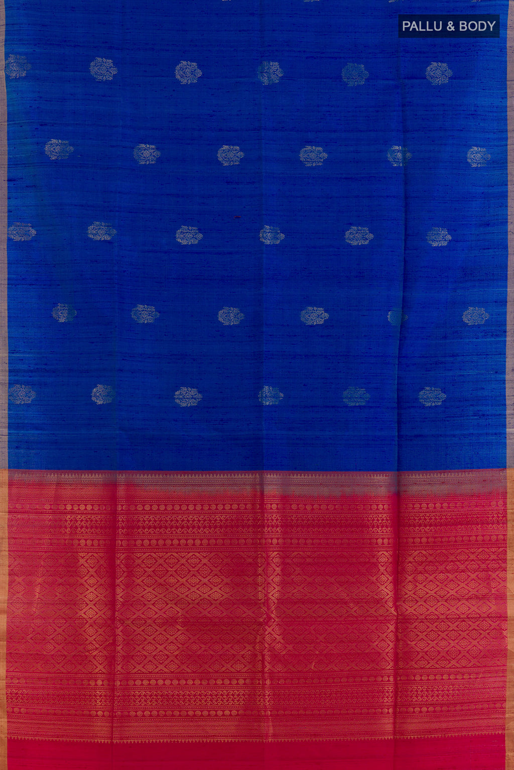 Flat view of Pure Silk Blue Raw Saree with Zari Butta on the body and Zari Border. 