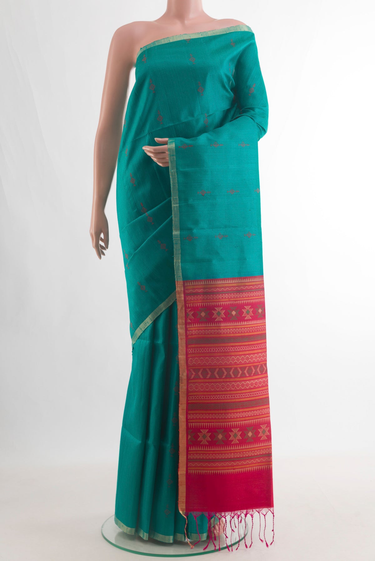 Pure Silk Sea Green Raw Saree with Thread Butta on the body and Zari Border.  displayed on a mannequin