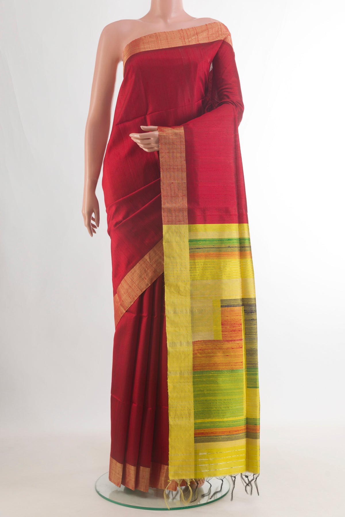 Pure Silk Red Raw Saree with Plain Body and Zari Border.  displayed on a mannequin