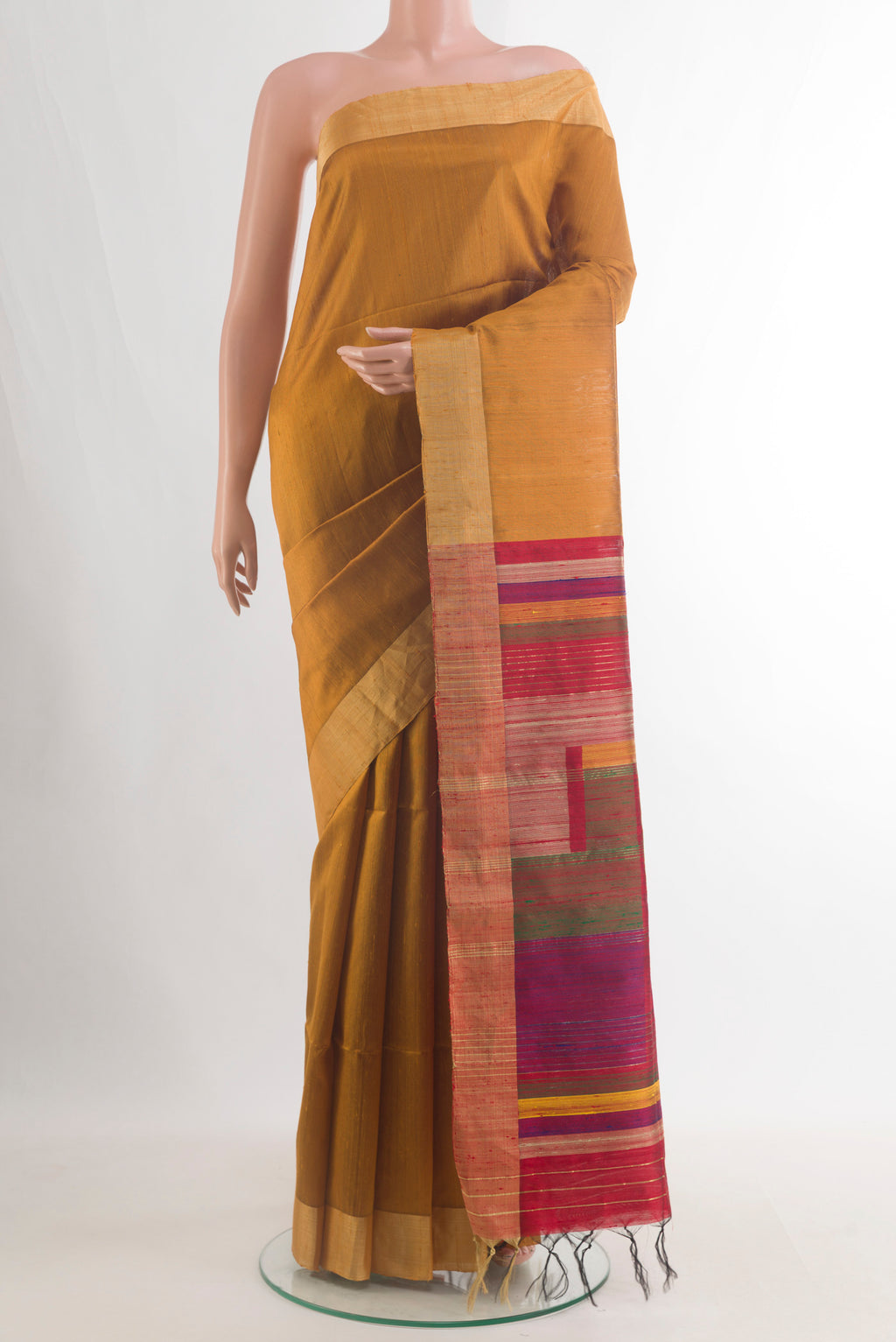 Pure Silk Mustard Raw Saree with Plain Body and Zari Border.  displayed on a mannequin