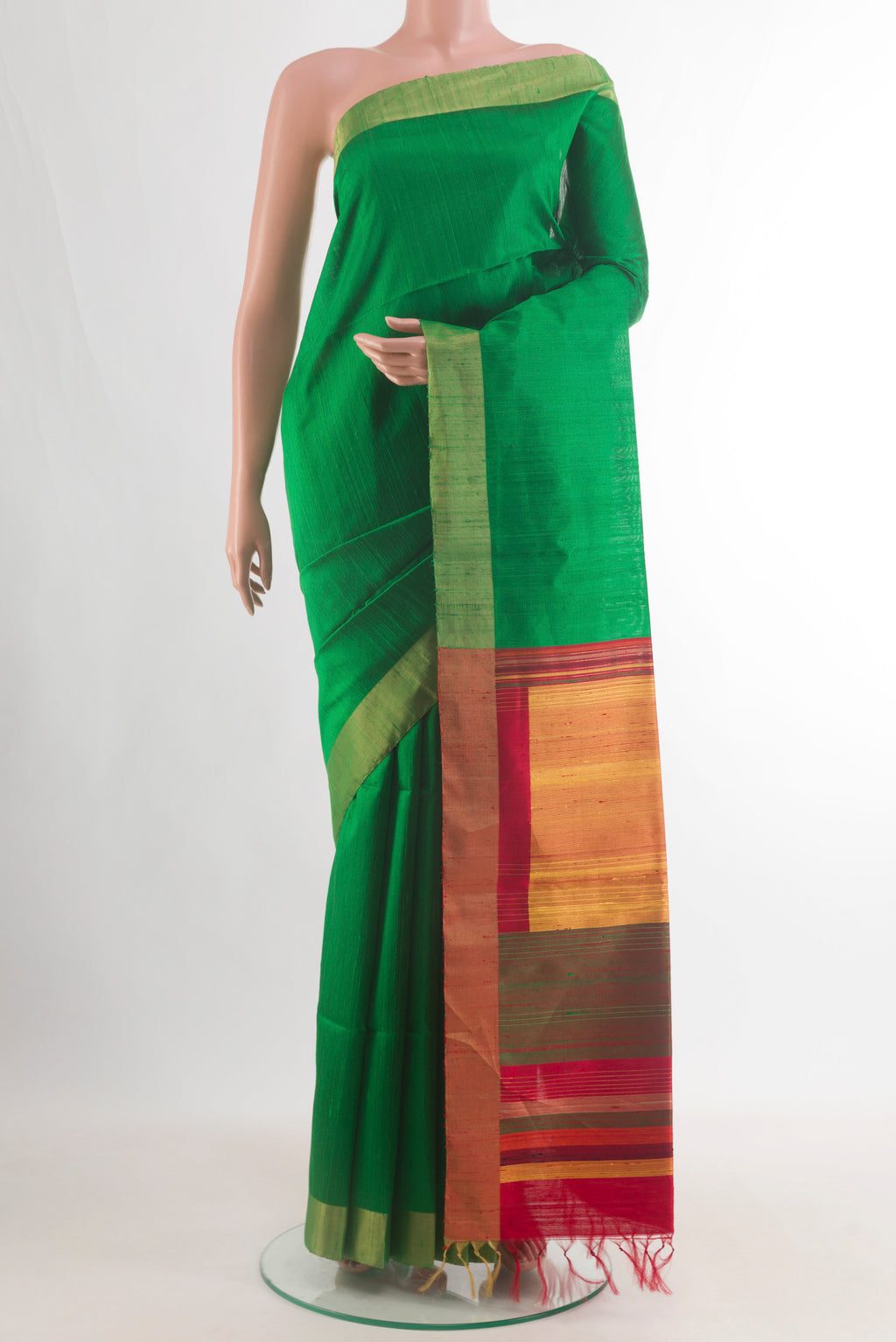 Pure Silk Green Raw Saree with Plain Body and Zari Border.  displayed on a mannequin