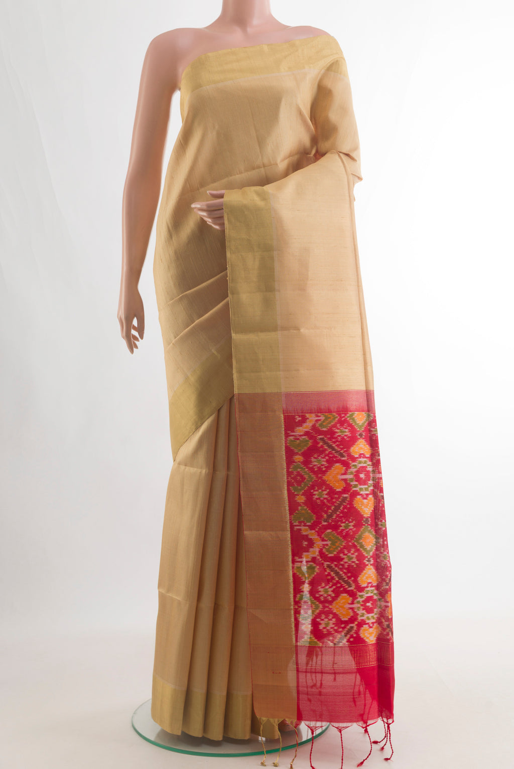 Pure Silk Sandal Raw Saree with Plain Body and Zari Border.  displayed on a mannequin