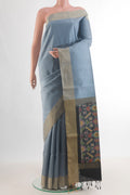 Pure Silk Grey Raw Saree with Plain Body and Zari Border.  displayed on a mannequin