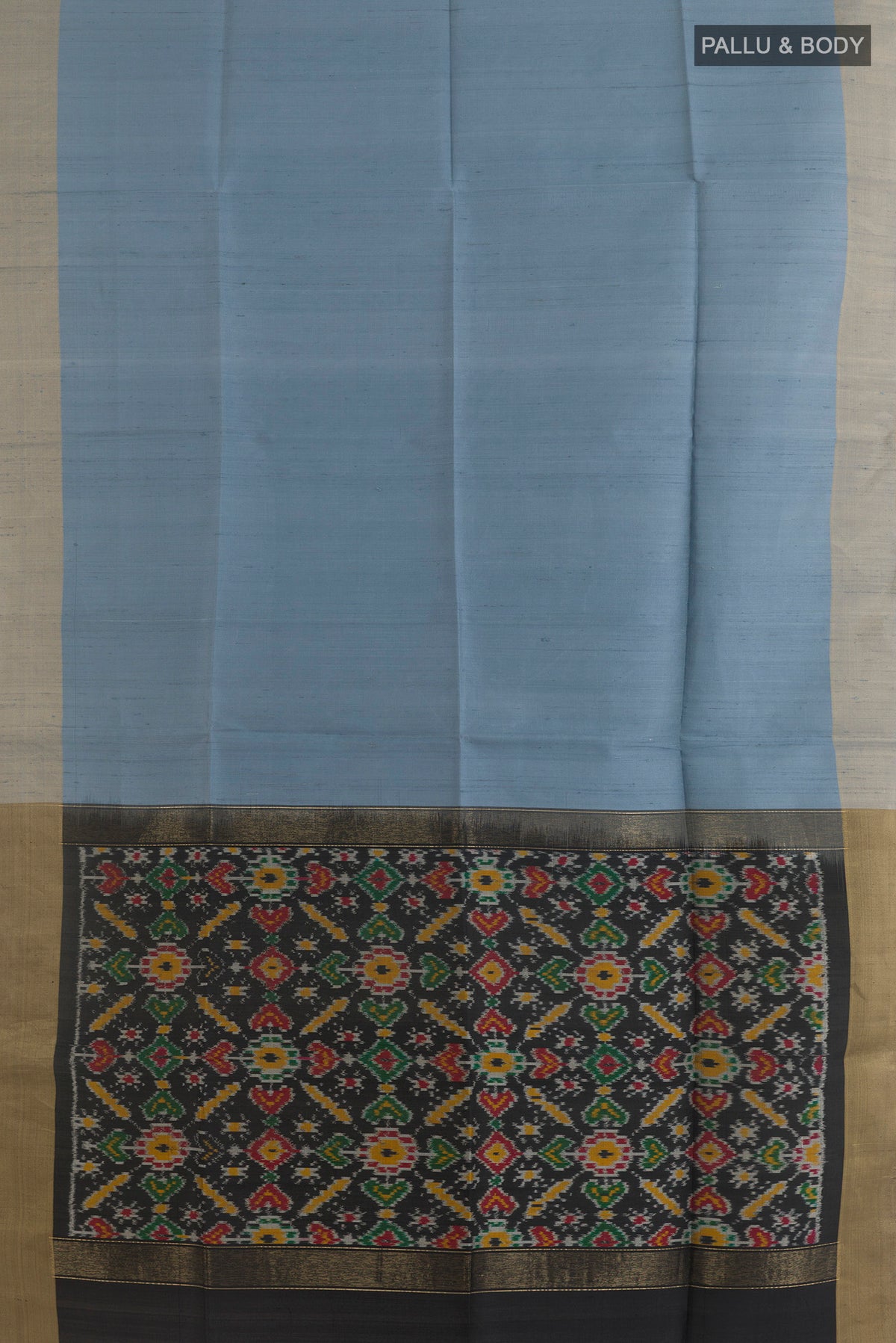 Flat view of Pure Silk Grey Raw Saree with Plain Body and Zari Border. 