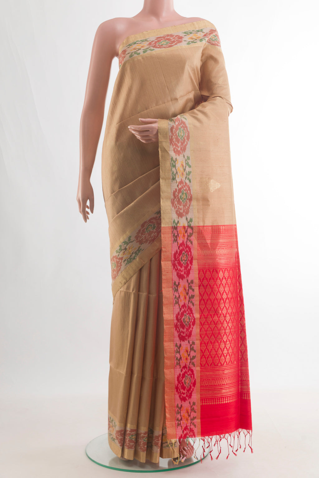 Pure Silk Beige Raw Saree with Zari Butta on the body and Zari Border.  displayed on a mannequin