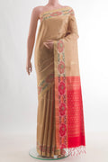 Pure Silk Beige Raw Saree with Zari Butta on the body and Zari Border.  displayed on a mannequin
