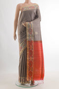 Pure Silk Grey Raw Saree with Zari Butta on the body and Ikat Border.  displayed on a mannequin