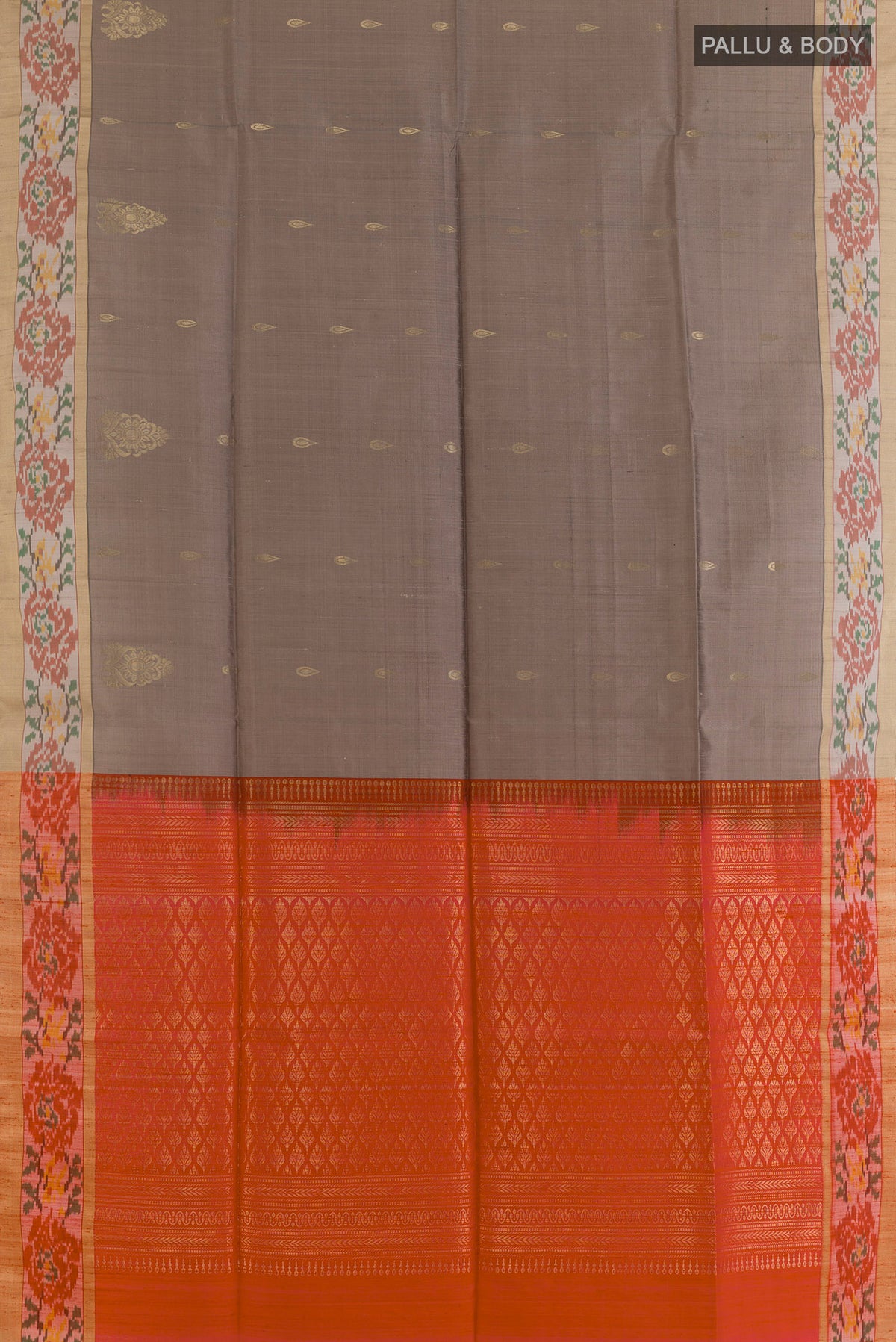 Flat view of Pure Silk Grey Raw Saree with Zari Butta on the body and Ikat Border. 