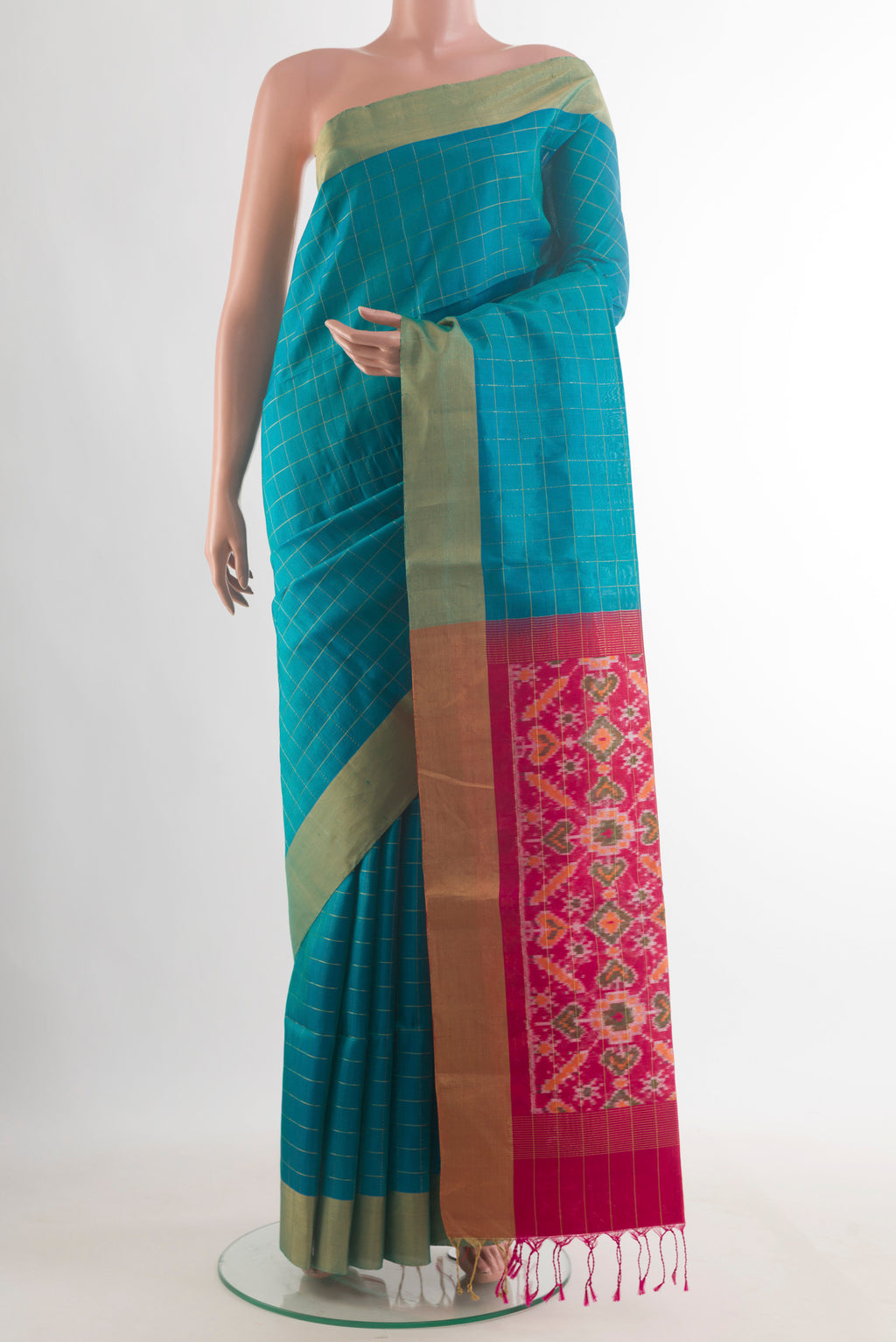 Pure Silk Blue Soft Saree with Checked design on the body and Zari Border.  displayed on a mannequin