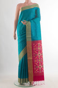 Pure Silk Blue Soft Saree with Checked design on the body and Zari Border.  displayed on a mannequin