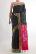 Pure Silk Black Soft Saree with Zari Butta on the body and Zari Border.  displayed on a mannequin