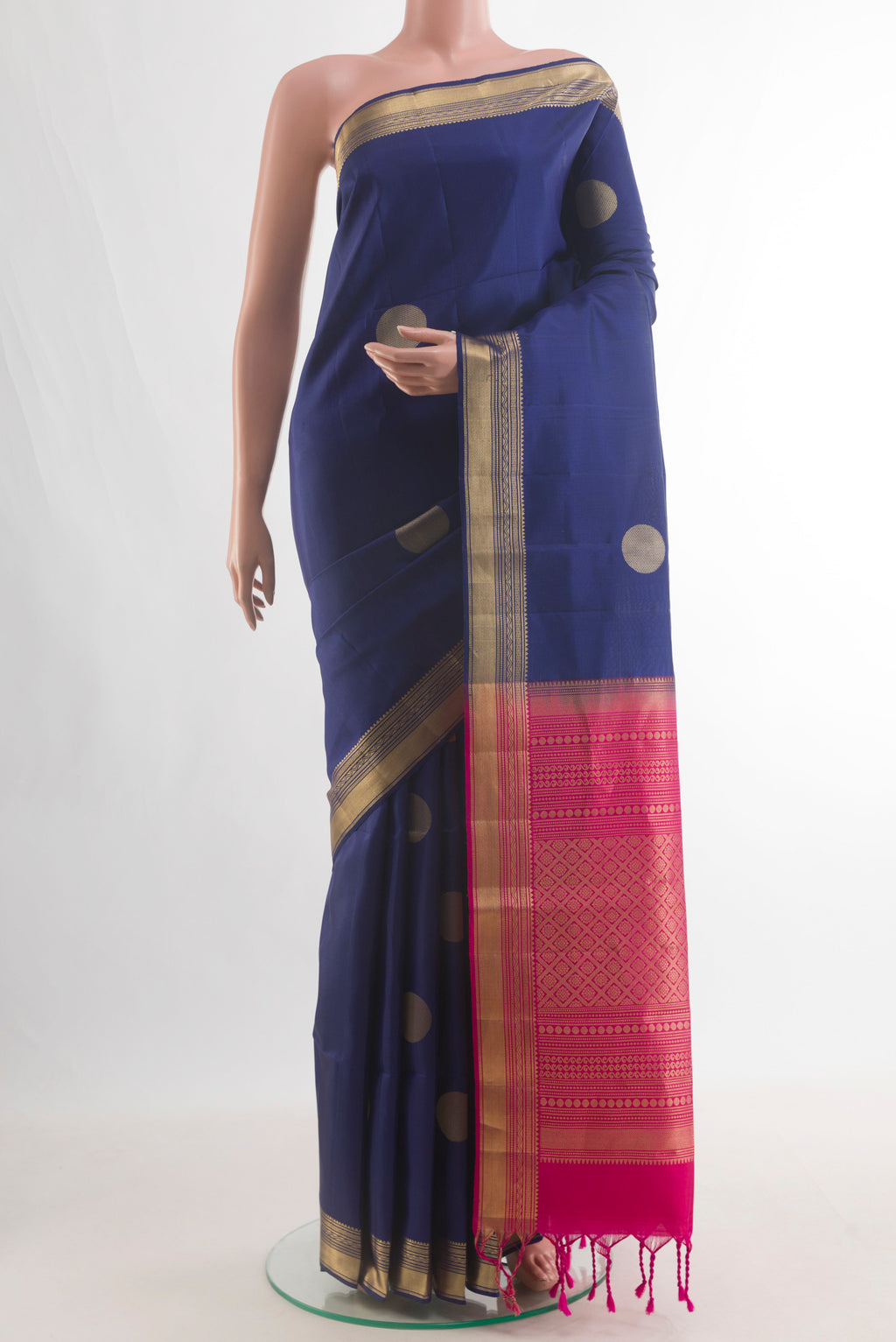 Pure Silk Dark Blue Soft Saree with Zari Butta on the body and Zari Border.  displayed on a mannequin