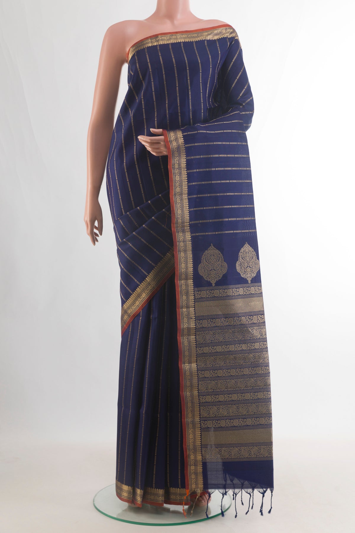 Pure Silk Navy Blue Soft Saree with Stripes on the body and Zari Border.  displayed on a mannequin