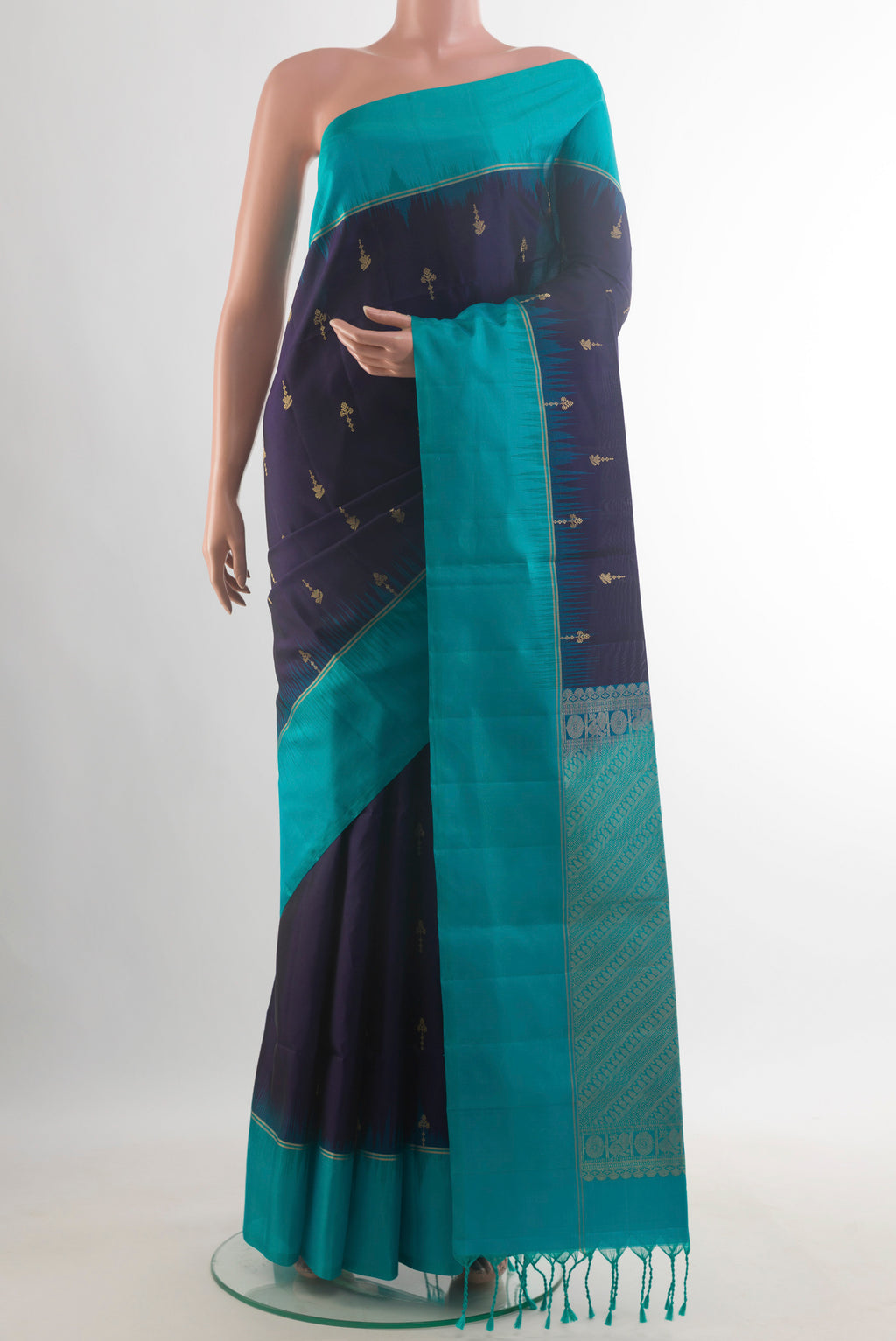 Pure Silk Navy Blue Soft Saree with Zari Butta on the body and Zari Border.  displayed on a mannequin