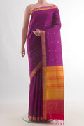 Pure Silk Magenta Soft Saree with Zari Butta on the body and Zari Border.  displayed on a mannequin