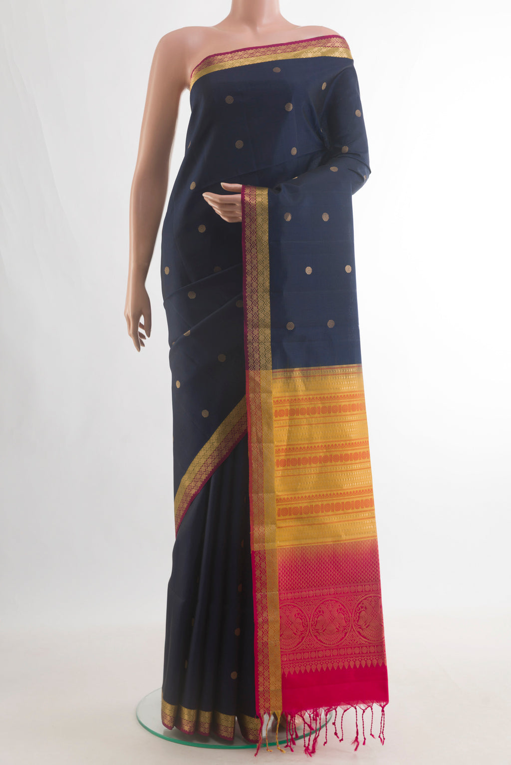 Pure Silk Navy Blue Soft Saree with Zari Butta on the body and Zari Border.  displayed on a mannequin