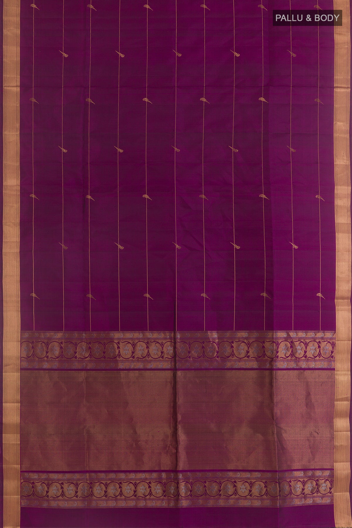 Flat view of Pure Silk Purple Soft Saree with Stripes on the body and Zari Border. 