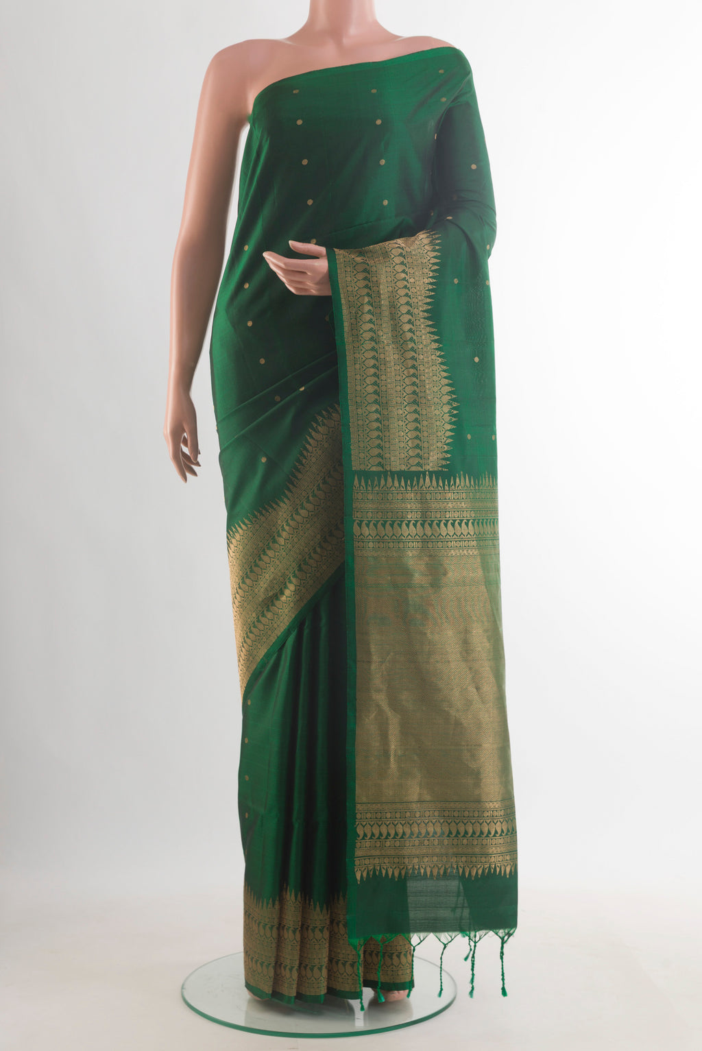 Pure Silk Green Soft Saree with Zari Butta on the body and Zari Border.  displayed on a mannequin
