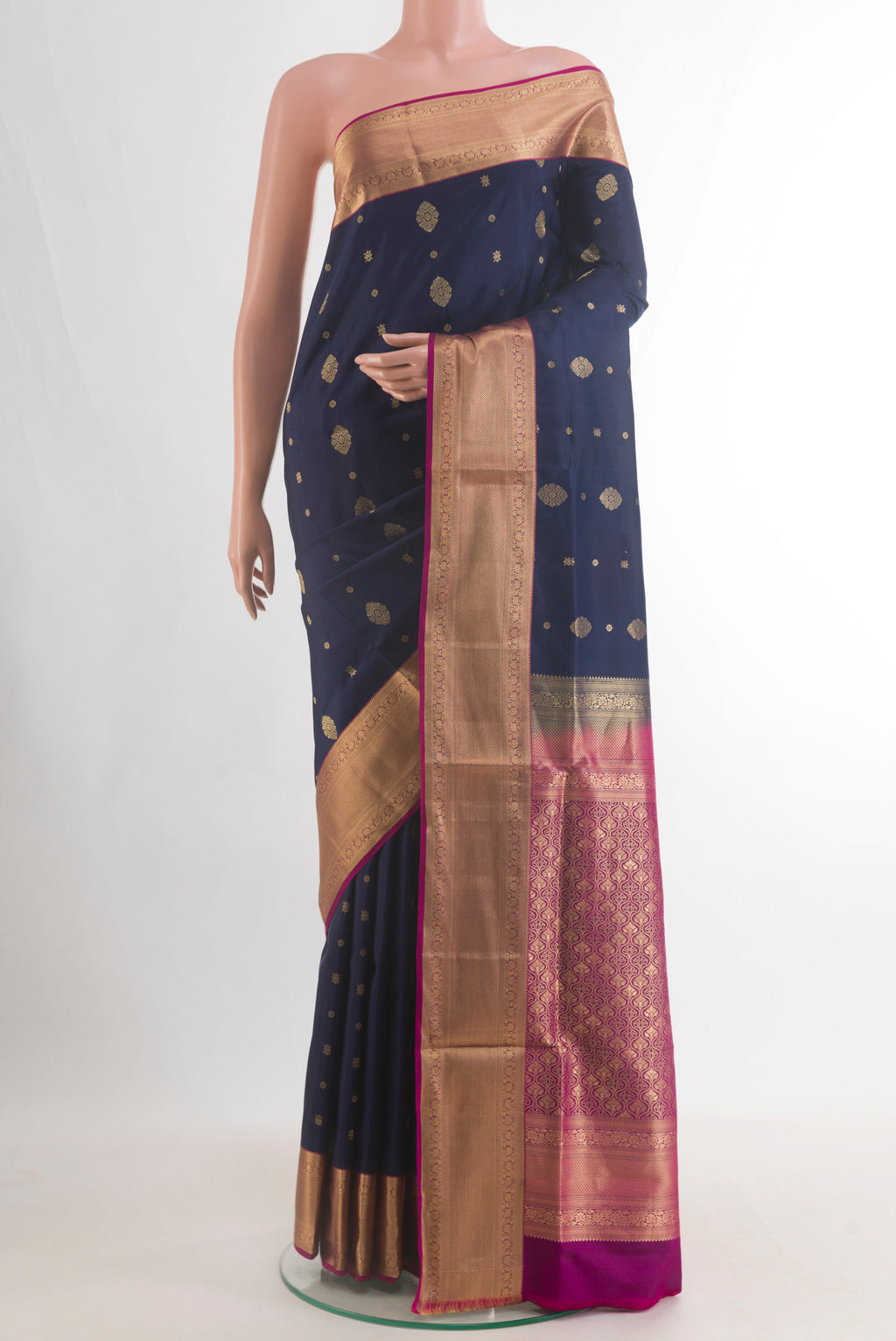Pure Silk Navy Blue Soft Saree with Zari Butta on the body and Zari Border.  displayed on a mannequin