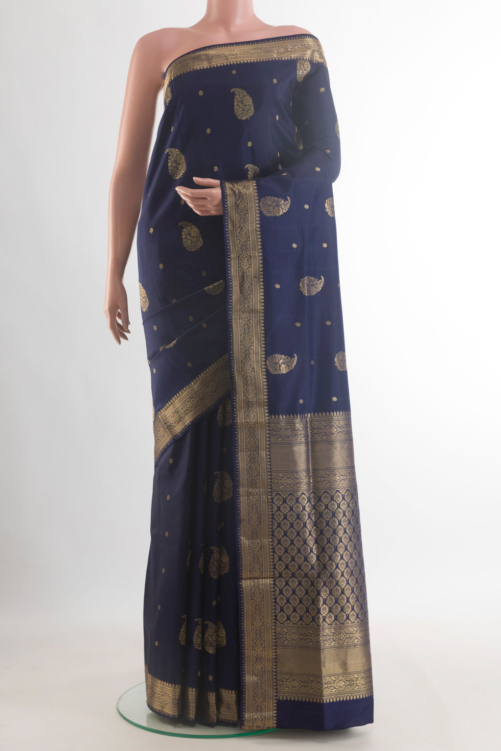 Pure Silk Navy Blue Soft Saree with Zari Butta on the body and Zari Border.  displayed on a mannequin