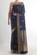 Pure Silk Navy Blue Soft Saree with Zari Butta on the body and Zari Border.  displayed on a mannequin