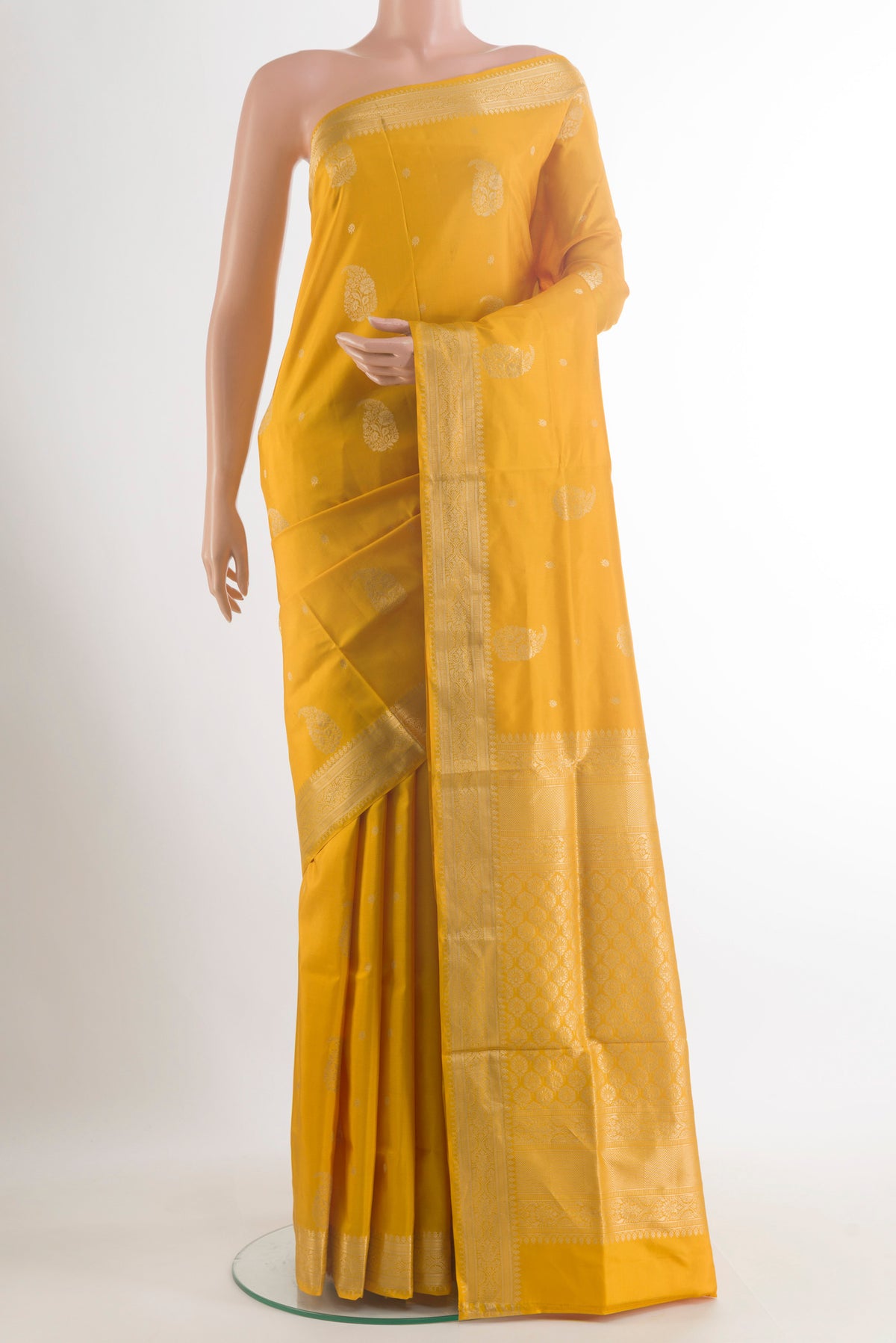Pure Silk Yellow Soft Saree with Zari Butta on the body and Zari Border.  displayed on a mannequin