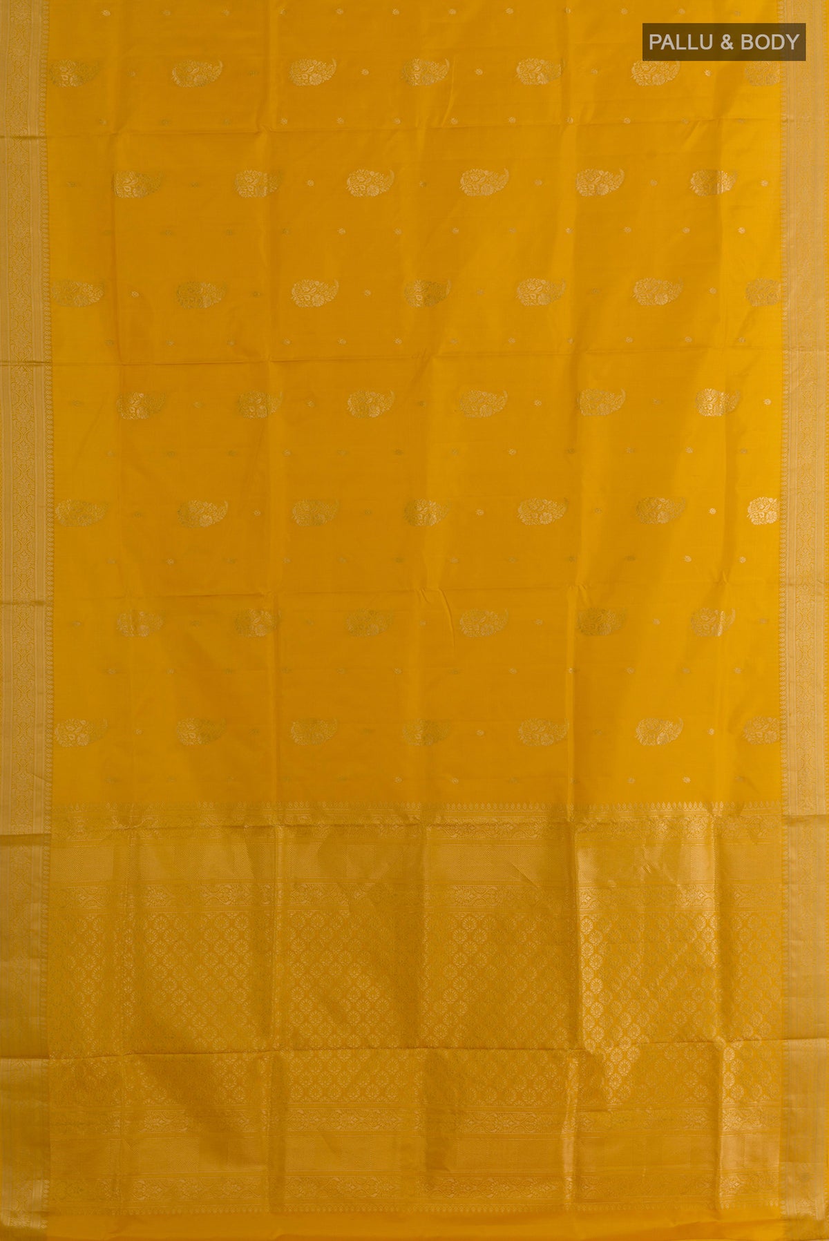 Flat view of Pure Silk Yellow Soft Saree with Zari Butta on the body and Zari Border. 