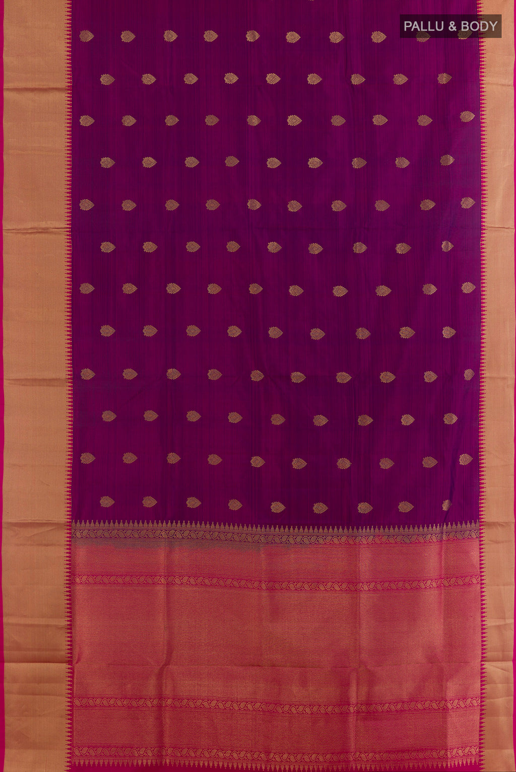 Flat view of Pure Silk Magenta Soft Saree with Zari Butta on the body and Zari Border. 