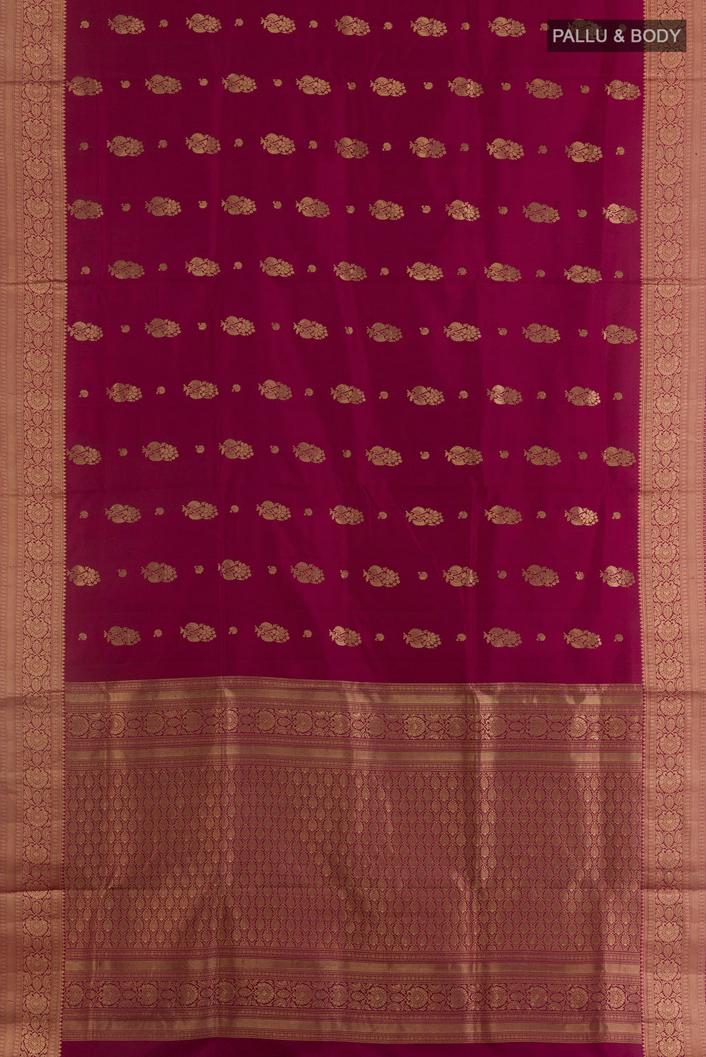 Flat view of Pure Silk Maroon Soft Saree with Zari Butta on the body and Zari Border. 