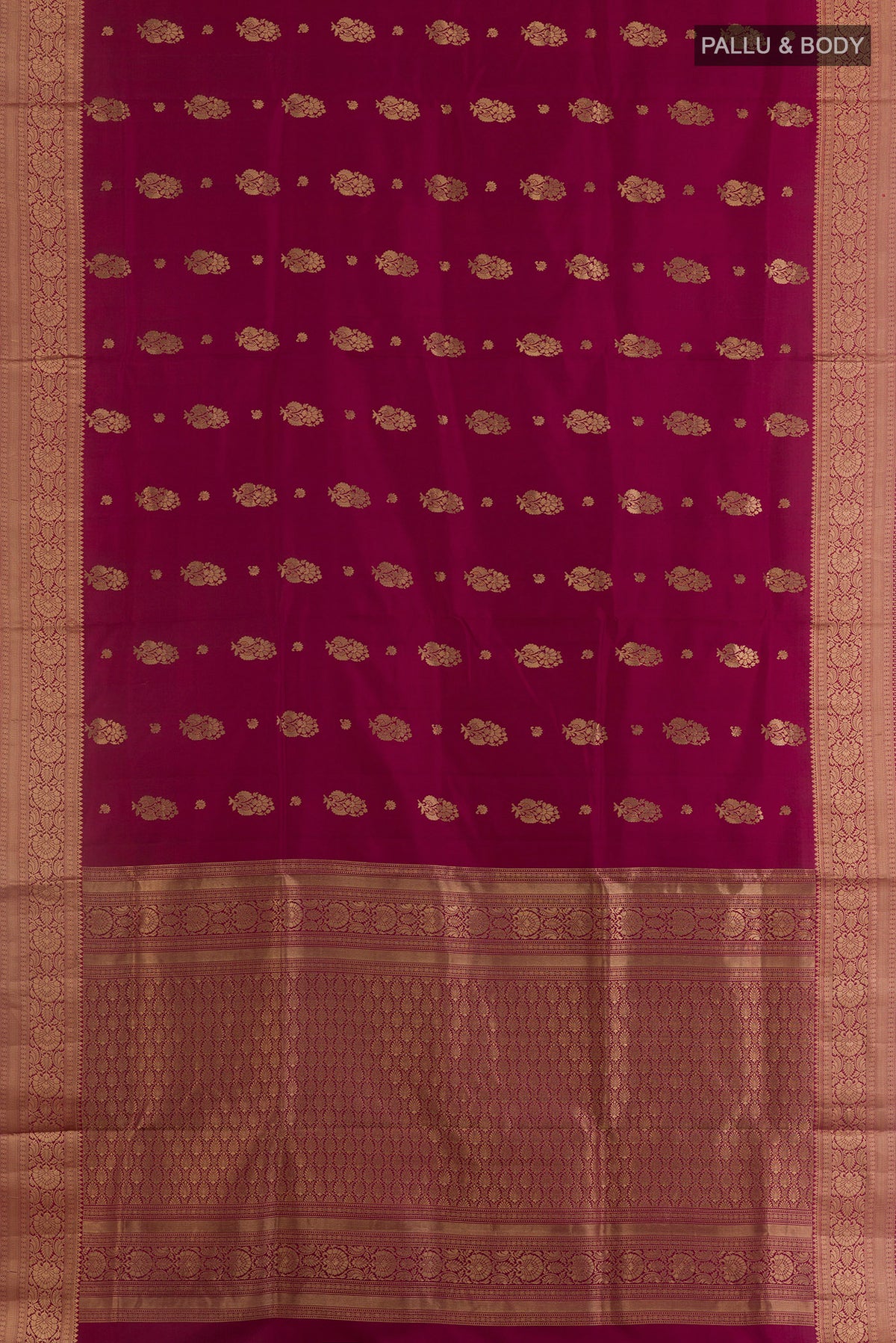 Flat view of Pure Silk Maroon Soft Saree with Zari Butta on the body and Zari Border. 