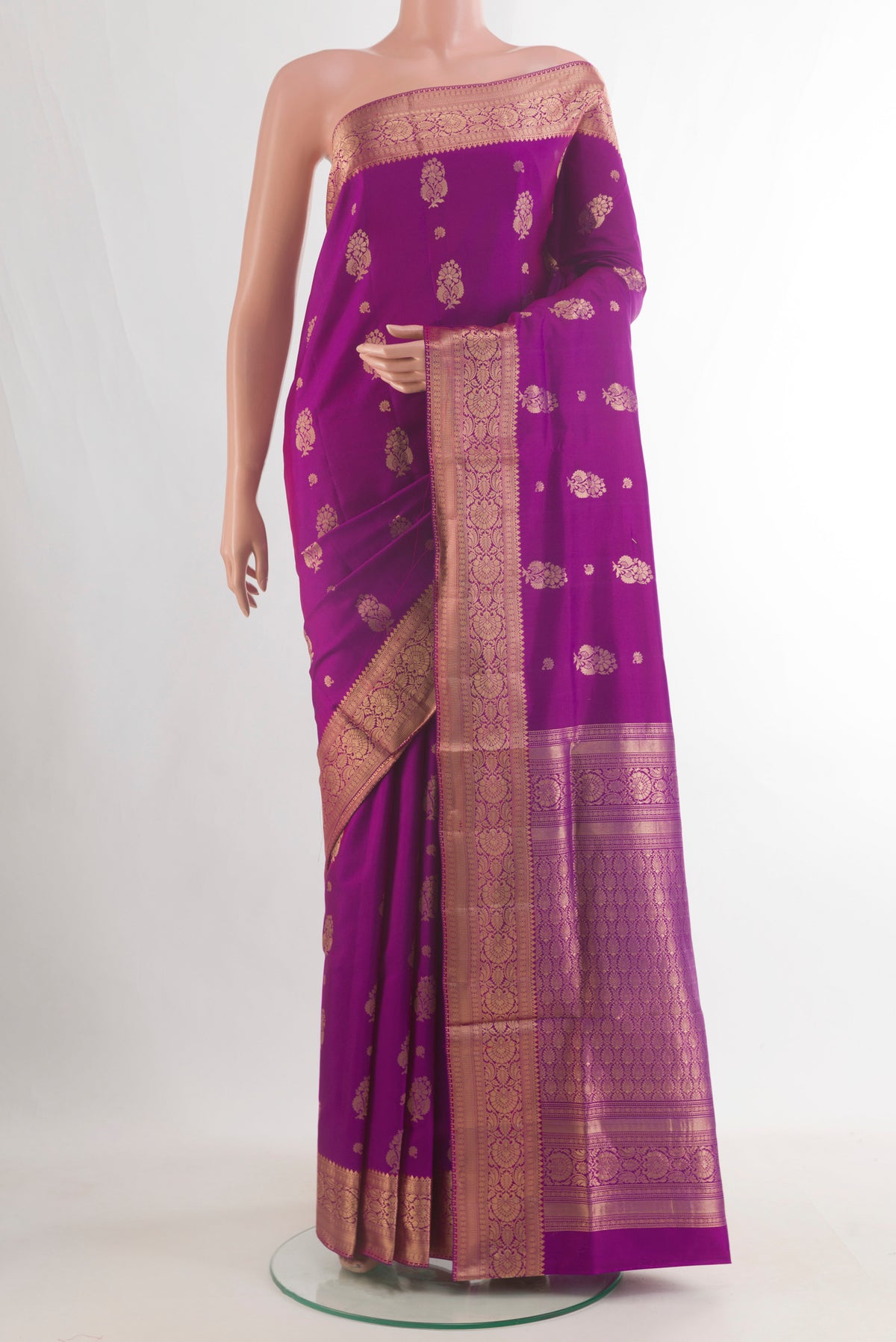 Pure Silk Magenta Soft Saree with Zari Butta on the body and Zari Border.  displayed on a mannequin