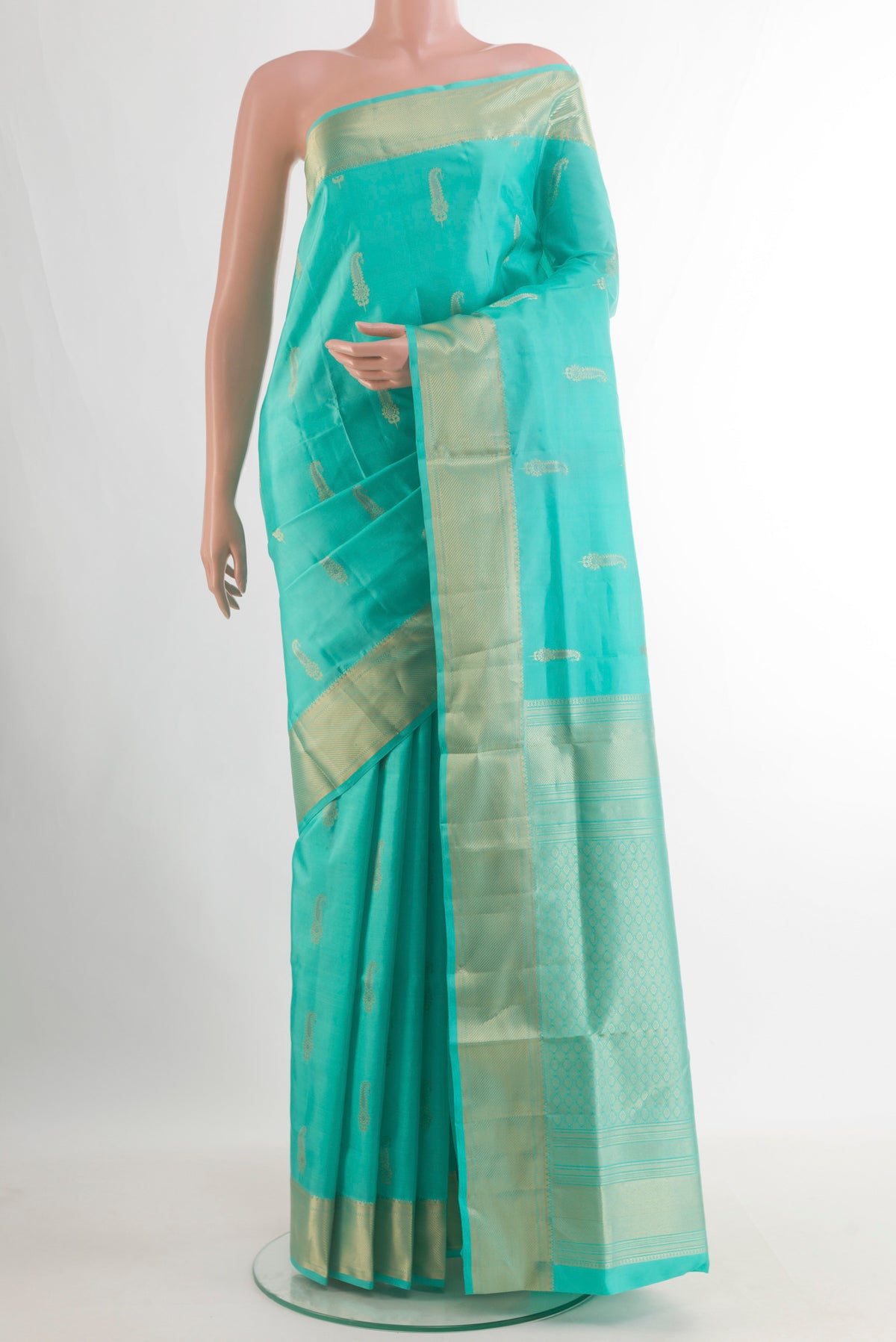 Pure Silk Sea Green Soft Saree with Zari Butta on the body and Zari Border.  displayed on a mannequin